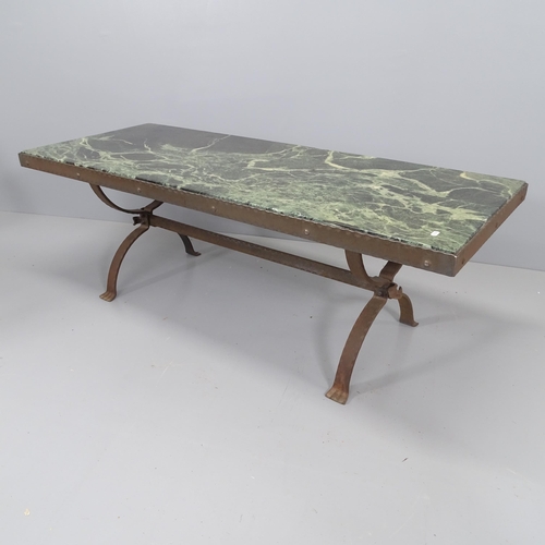 2166 - A marble-topped coffee table on cast iron base.148x52x58cm