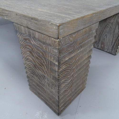 2168 - A contemporary French design cerused oak coffee table on stepped block legs. 150x36x80cm