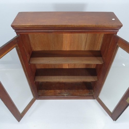 2170 - A Victorian mahogany bookcase with two glazed doors and two adjustable shelves. 88x118x26cm