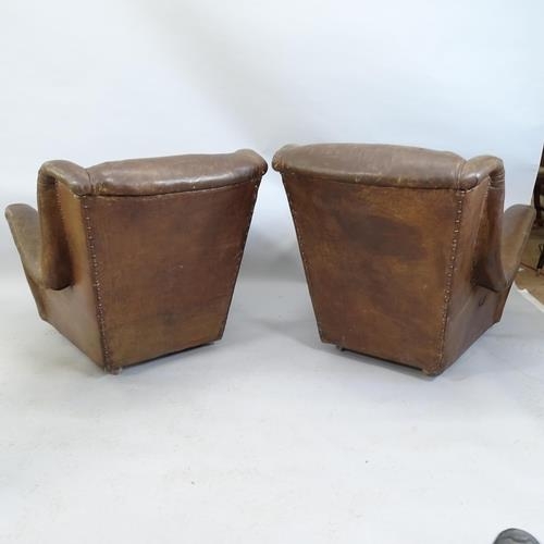 2176 - A pair of antique leather club armchairs.