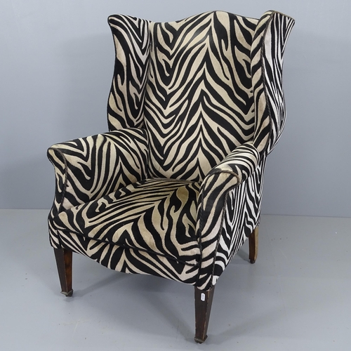 2177 - A Victorian wingback armchair with Zebra style upholstery.