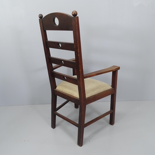 2182 - An Arts & Crafts oak ladder back armchair with heart and circle cut-outs.