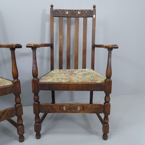 2183 - A pair of antique oak and upholstered open arm chairs, with carved and pierced decoration and drop-i... 