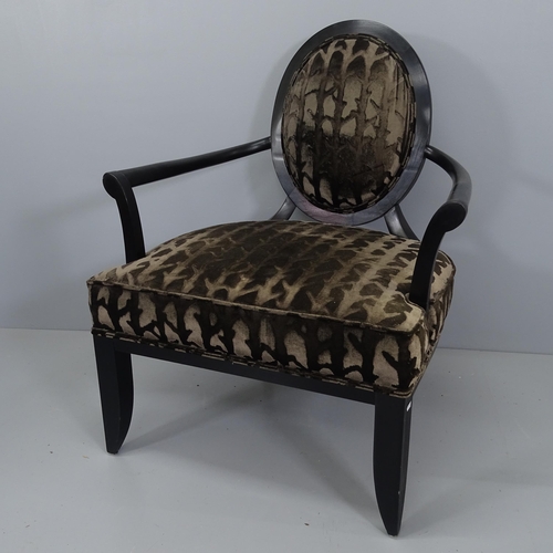 2185 - A modern upholstered open armchair with ebonised frame.