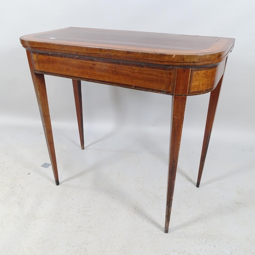 2631 - A 19th century mahogany and satinwood banded fold-over card table, raised on square tapered legs. 83... 