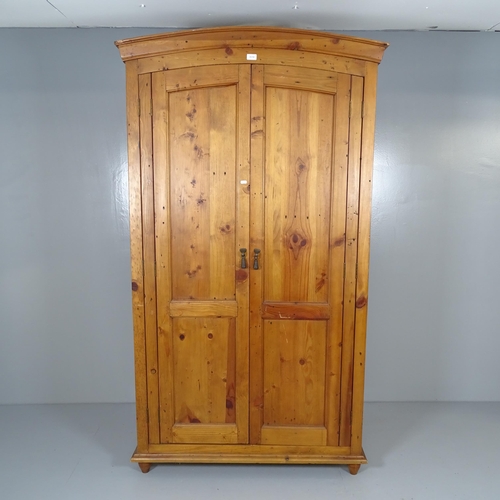 2619 - A modern pine two door dome-top wardrobe. 108x191x61cm