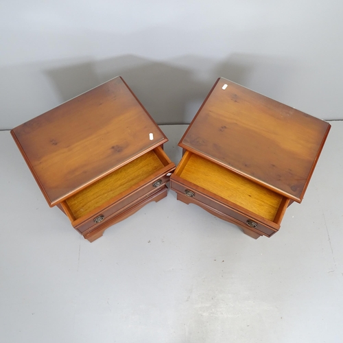 2634 - A pair of reproduction yew-wood bedside chests of four drawers, raised on bracket feet. 45x61x35cm