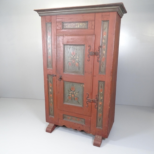 2637 - An 18th century continental folk art painted marriage armoire, with single panelled door and shelf-f... 