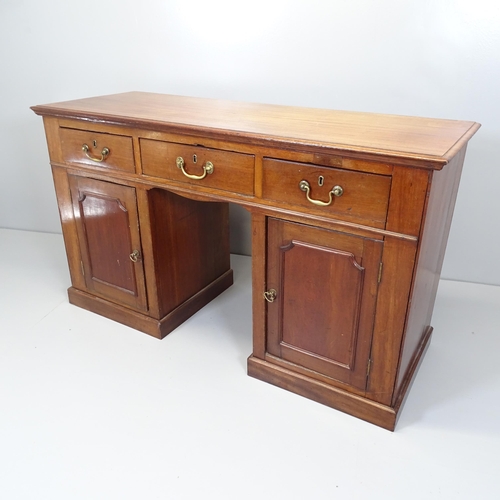 2638 - An antique mahogany kneehole writing desk with three drawers and cupboards under. Overall 136x79x49c... 