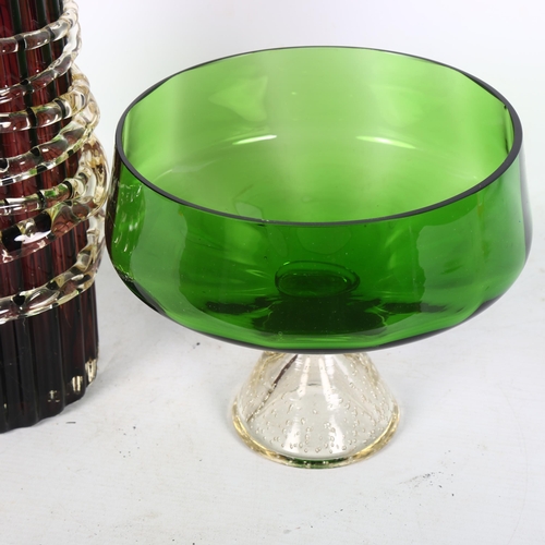 253 - A green glass bon bon dish with bubble stem decoration, and a large fluted glass vase with rope or v... 