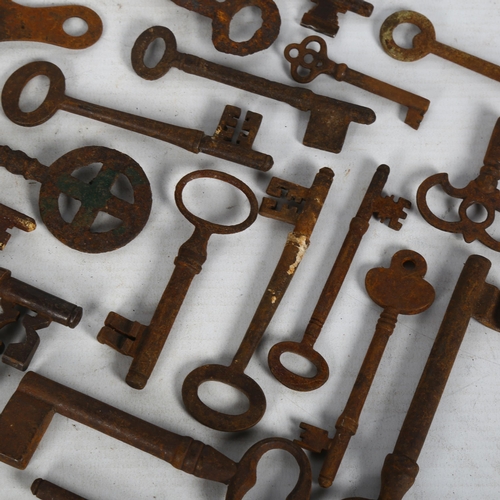 275 - A quantity of Antique door keys, of various sizes and shapes, there are some clock keys also