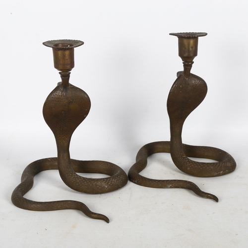 276 - A pair of Indian brass King Cobra candle sticks, H21cm