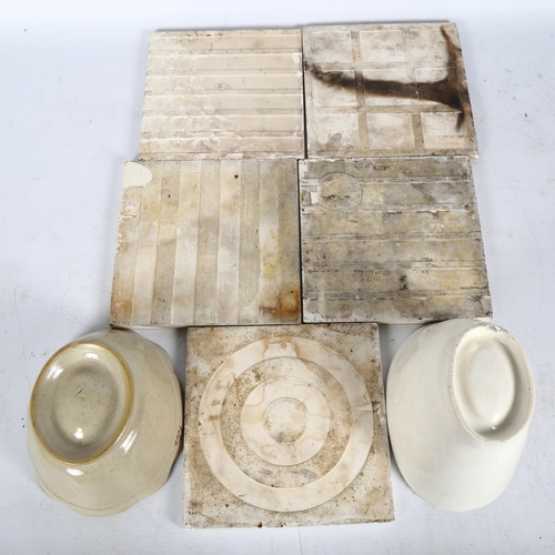 284 - A quantity of Antique ceramic tiles with varying designs, and 2 Antique Victorian jelly moulds with ... 