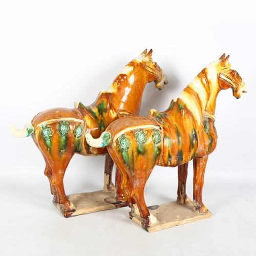 286 - A pair of Tang style glazed pottery horses on plinths, H36cm