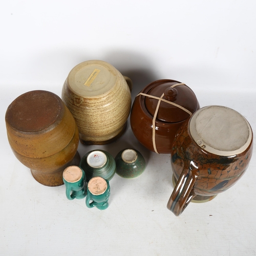 292 - A quantity of Studio pottery, including a stoneware milk jug by Andrew Rudebeck, a terracotta vase, ... 