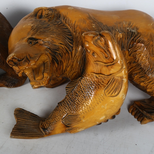 300 - 2 similar Hokkaido style pine sculptures of bears, both with salmon, largest length 36cm