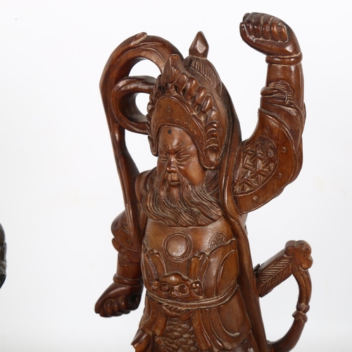 366 - A carved wood Samurai figure, H30cm, and a bronze patinated Chinese figure