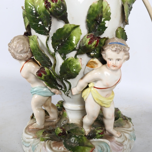 378 - An Antique German porcelain oil lamp, supported by 3 cherubs, H35cm