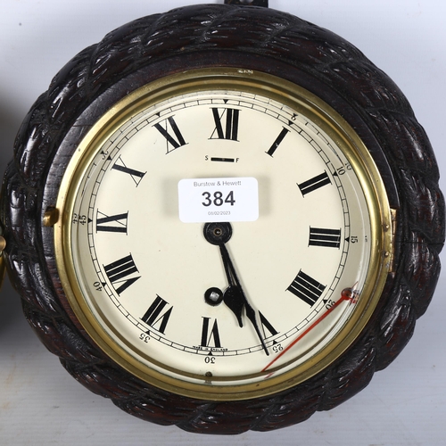 384 - 2 ship's bulkhead clocks - a Schatz Royal Mariner brass-cased clock, 18cm, and another with carved r... 