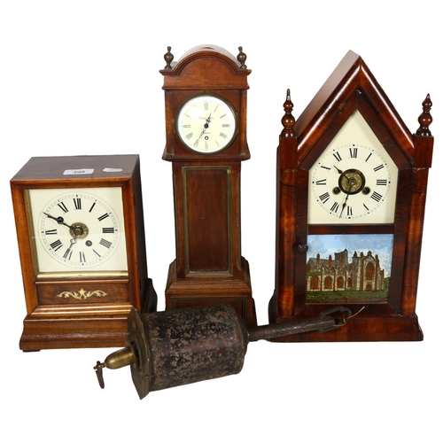 398 - A longcase style clock by Evans of Uckfield, 40cm, a lancet clock with church illustration, and anot... 