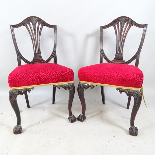 2704 - A pair of antique Chippendale-style ebonised and upholstered dining chairs, with shield backs, raise... 