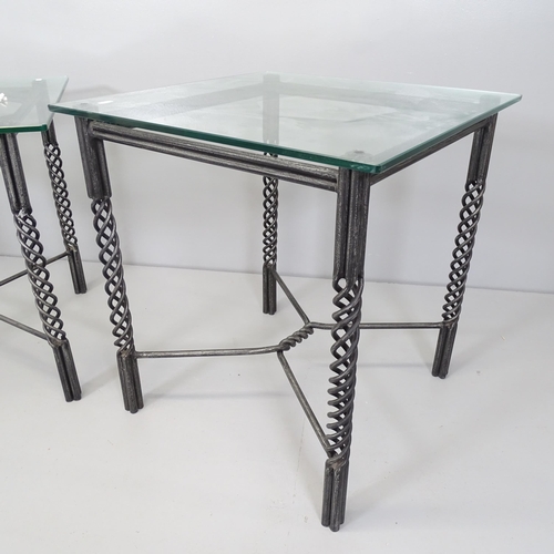 2661 - A pair of similar square glass top occasional tables on wrought iron base. Largest 60x62cm.