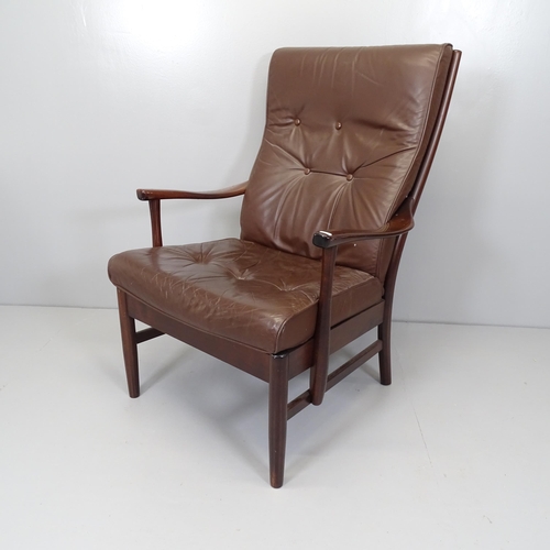 2662 - A mid-century Danish stained beech and leather upholstered lounge chair, with label for Farstrup.