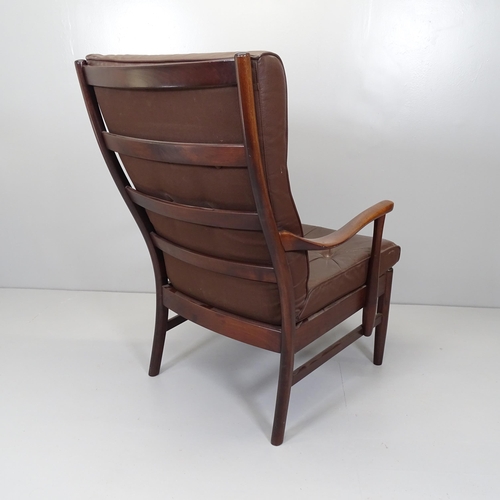 2662 - A mid-century Danish stained beech and leather upholstered lounge chair, with label for Farstrup.