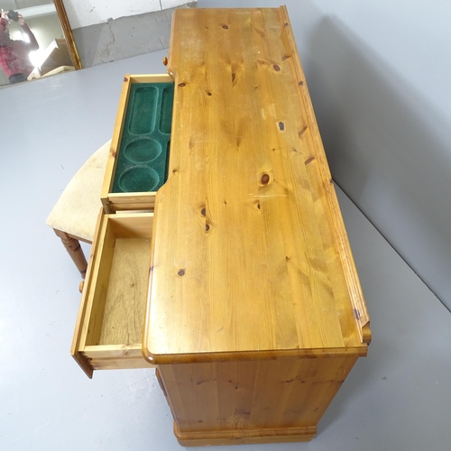 2666 - A modern pine kneehole dressing table / desk with nine fitted drawers. 146x76x45cm, and a matching s... 