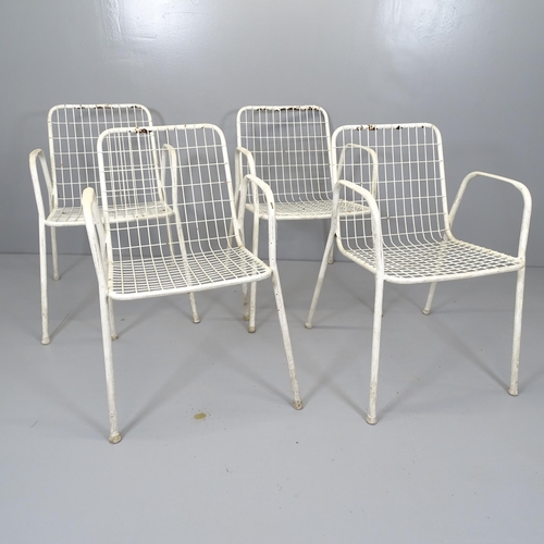 2670 - A set of four white-painted wirework garden stacking chairs.