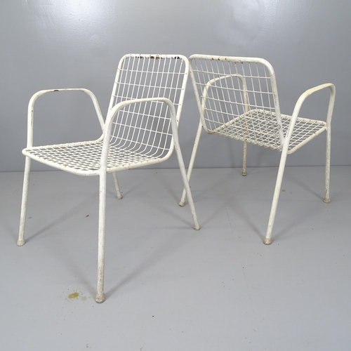 2670 - A set of four white-painted wirework garden stacking chairs.