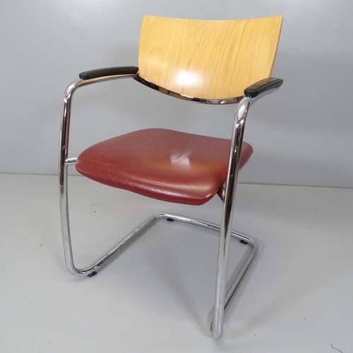 2685 - A mid-century style leather upholstered desk chair on tubular steel frame, with bent ply back.