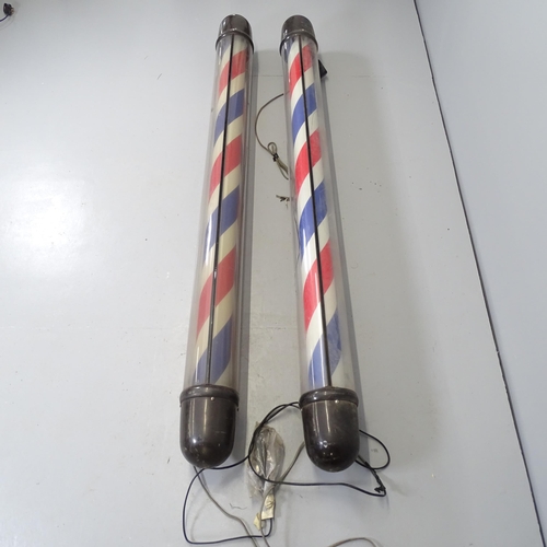 2700 - A pair of wall mounted barber's poles. Height 190cm.