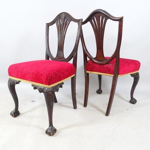 2704 - A pair of antique Chippendale-style ebonised and upholstered dining chairs, with shield backs, raise... 