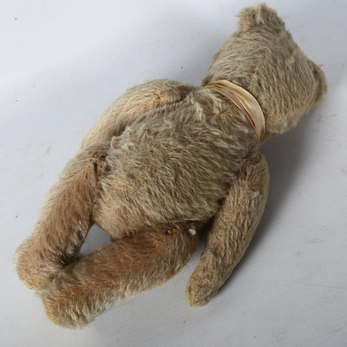 120 - A Vintage straw-filled teddy bear, L30cm