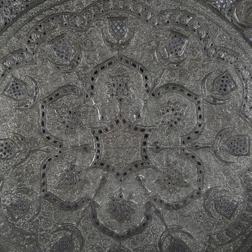 13 - A 19th century Indo-Persian pierced and embossed tinned copper charger, diameter 61cm