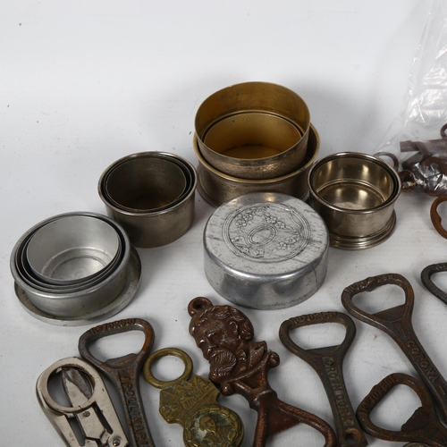 131 - A collection of Vintage advertising bottle openers, keys, nesting beakers etc