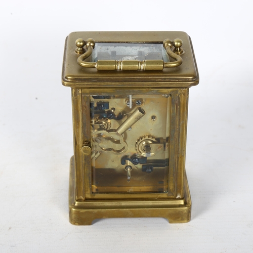 138 - J C VICKERY - a brass-cased carriage clock with enamel dial, Romany numerals and alarm dial, complet... 