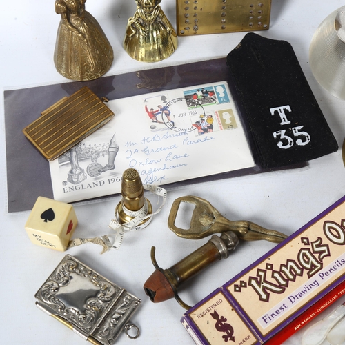 144 - A brass Cribbage board, crinoline bell dolls, a table bell, epaulette, a glass ribbed Vesta, notecas... 