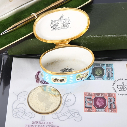 148 - An Elizabeth II 1977 silver-gilt medallic First Day Cover coin and stamps, in original case, a Cross... 