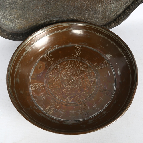 153 - An Eastern allover engraved copper tray, and a similar Eastern copper bowl, tray length 52cm