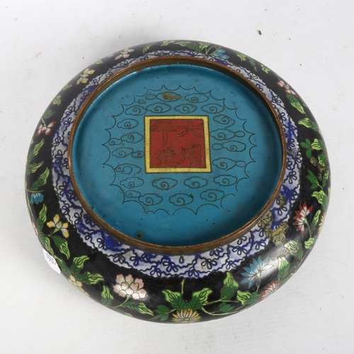 163 - A black ground cloisonne bowl, flower decoration, with 4 character mark to the base, diameter 25cm, ... 