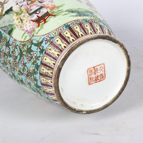 165 - A Chinese famille verte baluster vase with painted village scenes, and red seal mark to the base, H3... 