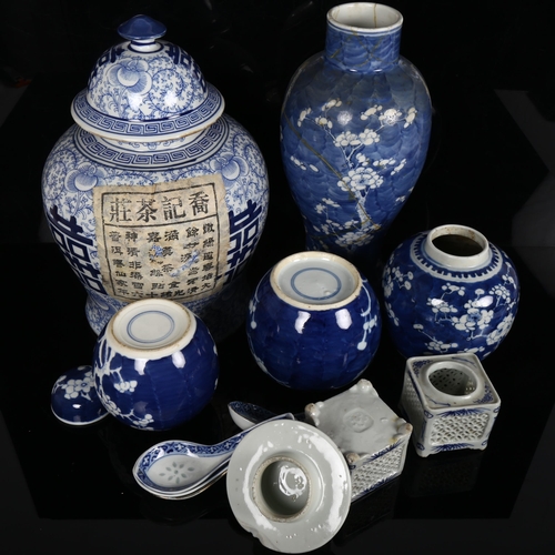 172 - A group of Chinese blue and white vases, to include a large baluster vase with lid, 3 prunus decorat... 