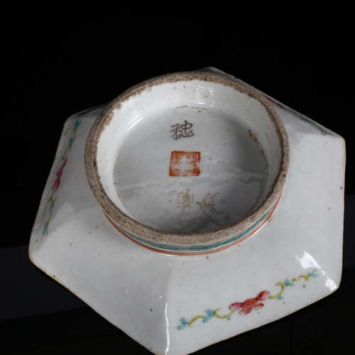 174 - A Chinese famille rose octagonal bowl on foot, with enamelled decoration, and red character stamp to... 