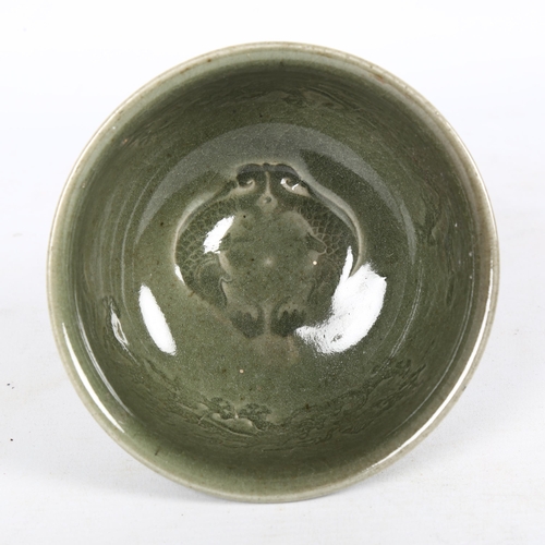 179 - A Chinese celadon stem cup, the bowl decorated with dragons, H12cm