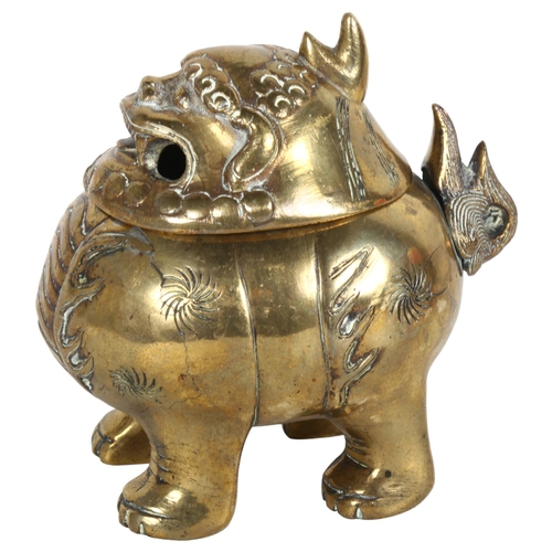 183 - A Chinese brass dog of fo censer, with engraved and embossed decoration and hinged lid, H12cm