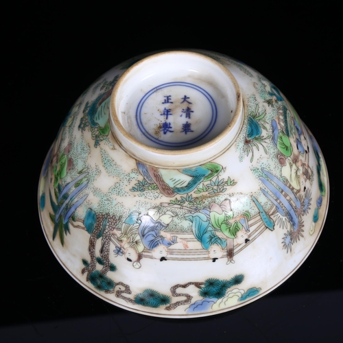 186 - A Chinese famille verte bowl on foot, with painted village figure decoration, and a blue six charact... 