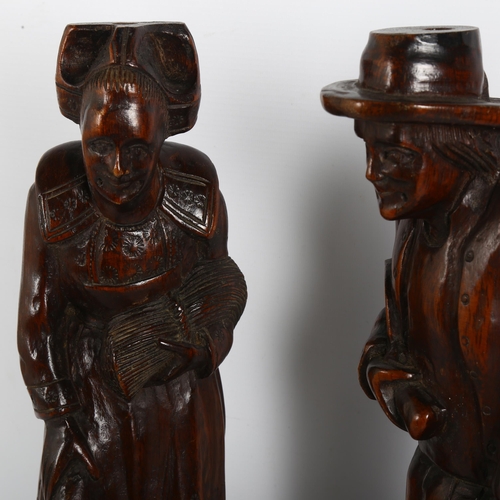 196 - A pair of 19th century carved and stained wood figures, height 44cm