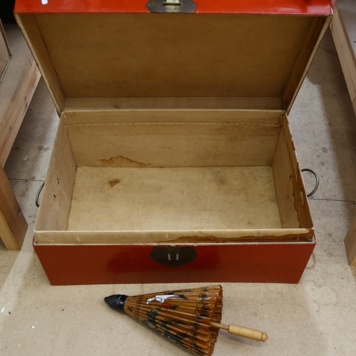 201 - A Chinese red lacquered blanket box, with leather interior, and a modern parasol, 74.5 x 31 x 48cm